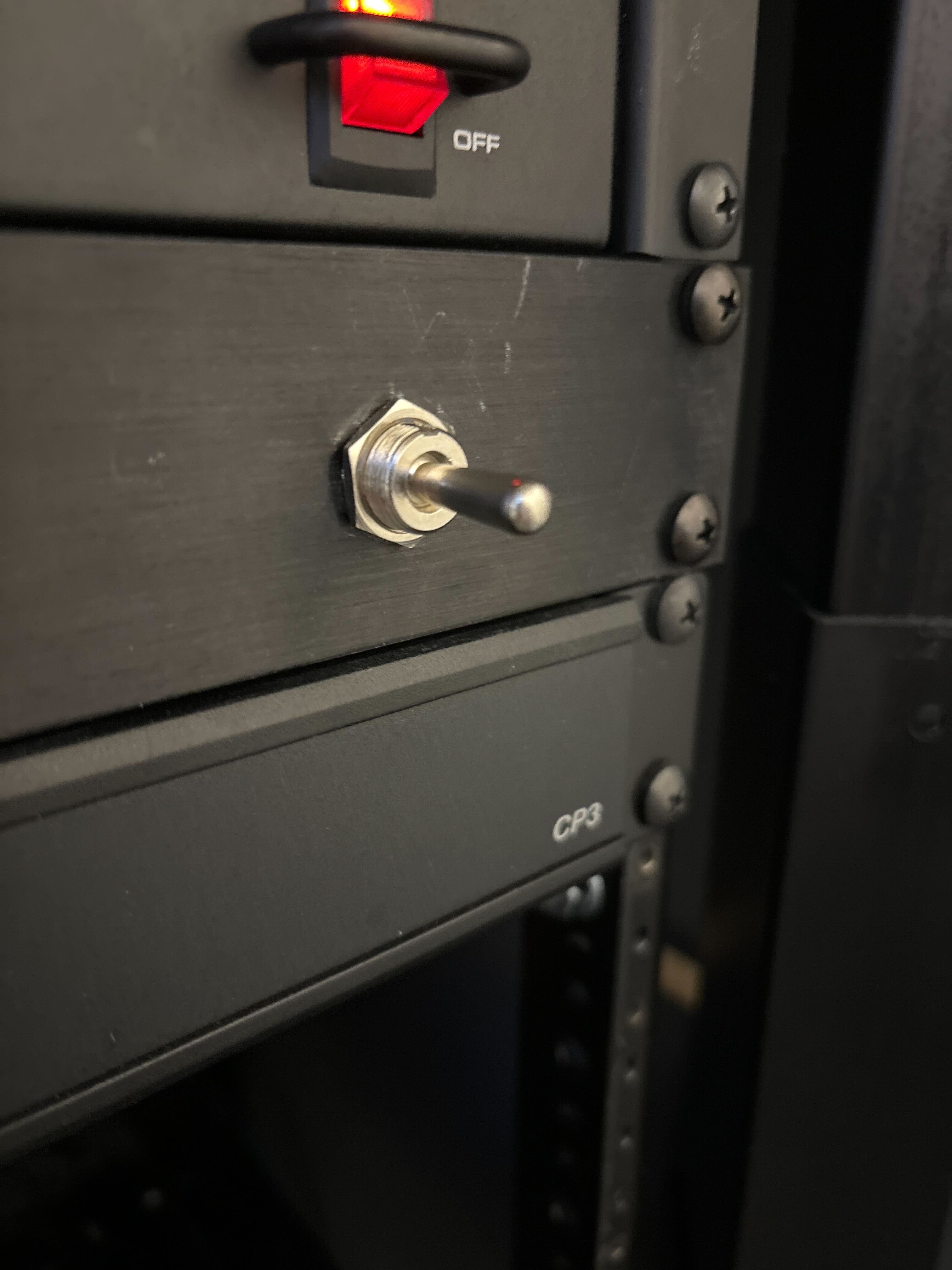 silver switch that controls projector.